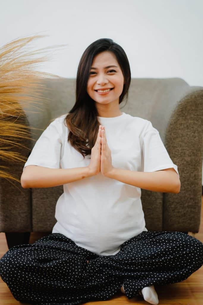 A pregnant woman doing prenatal yoga, the perfect exercise for pregnancy